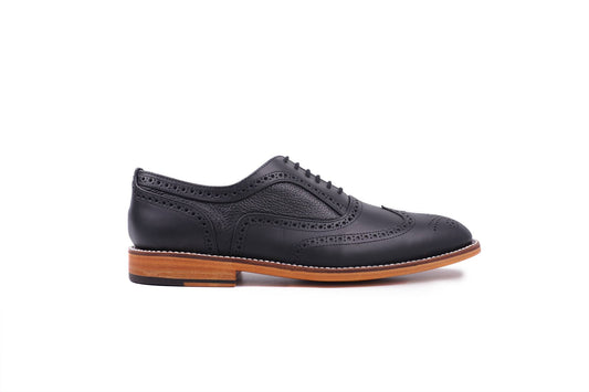Coleman LTD de piel color negro — vista lateral — Miles & Louie